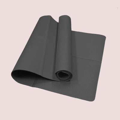 Roll of gray mat on a light pink background